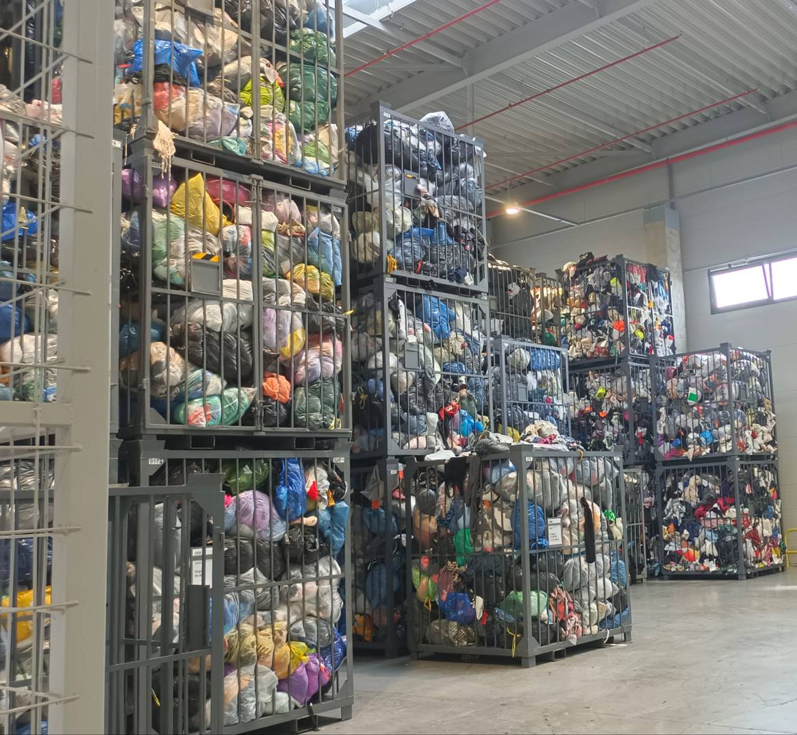 Up to the ceiling - post-consumer garments that have come in through TexCycle containers and other routes.