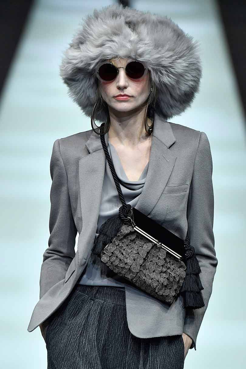 Armani sets his classical style against theatrical excess