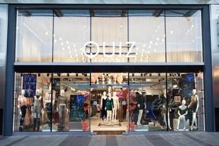 Quiz reports 15 percent drop in sales, warns of loss