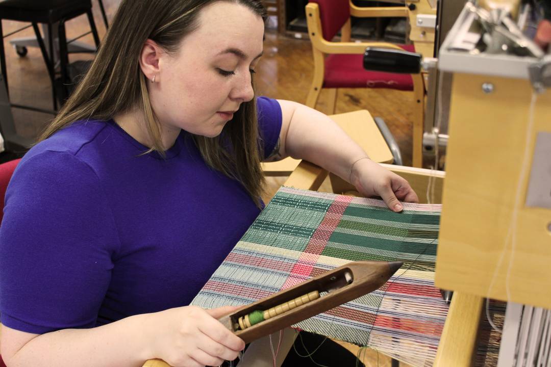 Rebecca Welsh working on her textile designs.