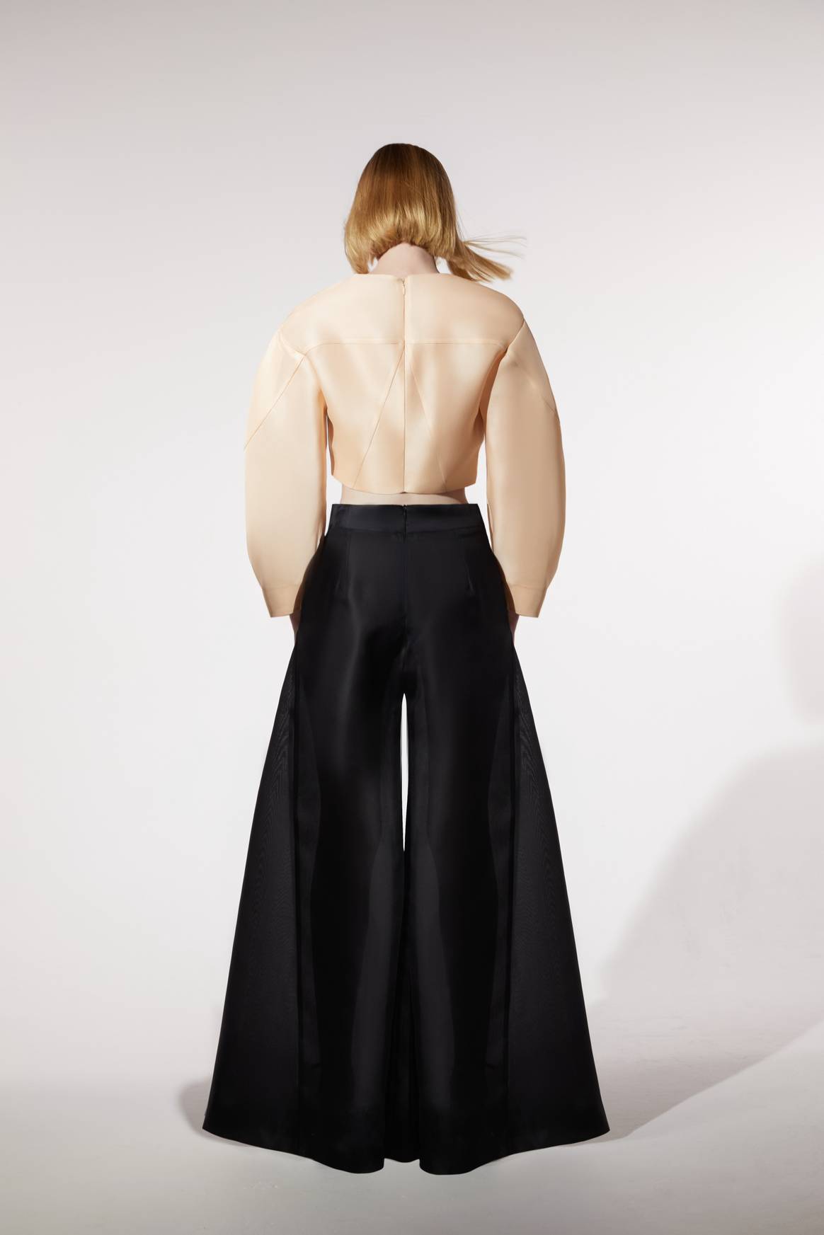 Temily SS26: The Songlines Powerpuff Crop in Ecru with Isosceles Trouser in Obsidian.