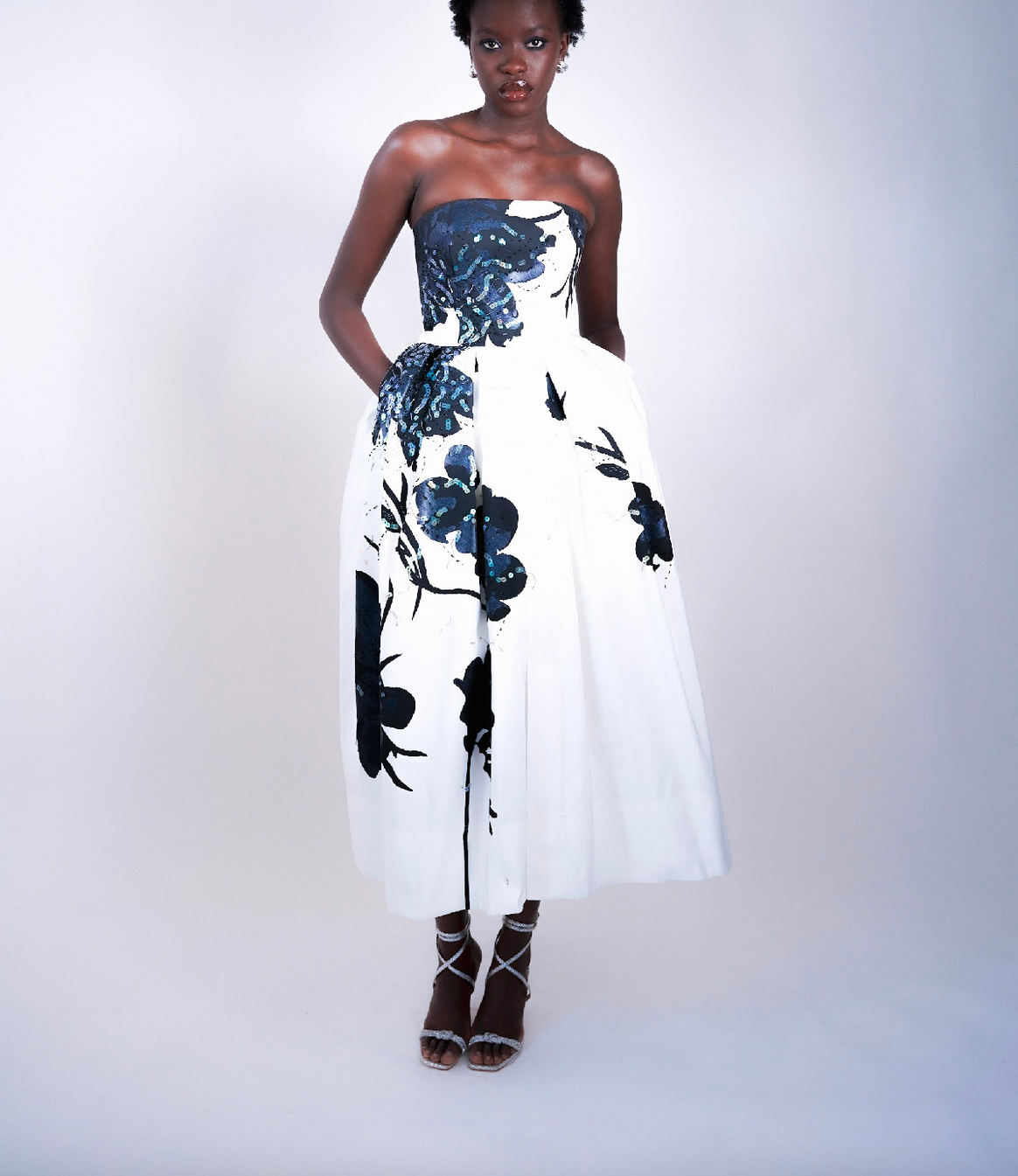 The couture gown features two distinct shades of Sparxell's signature blue - a sophisticated matte finish and a brilliant shimmery effect