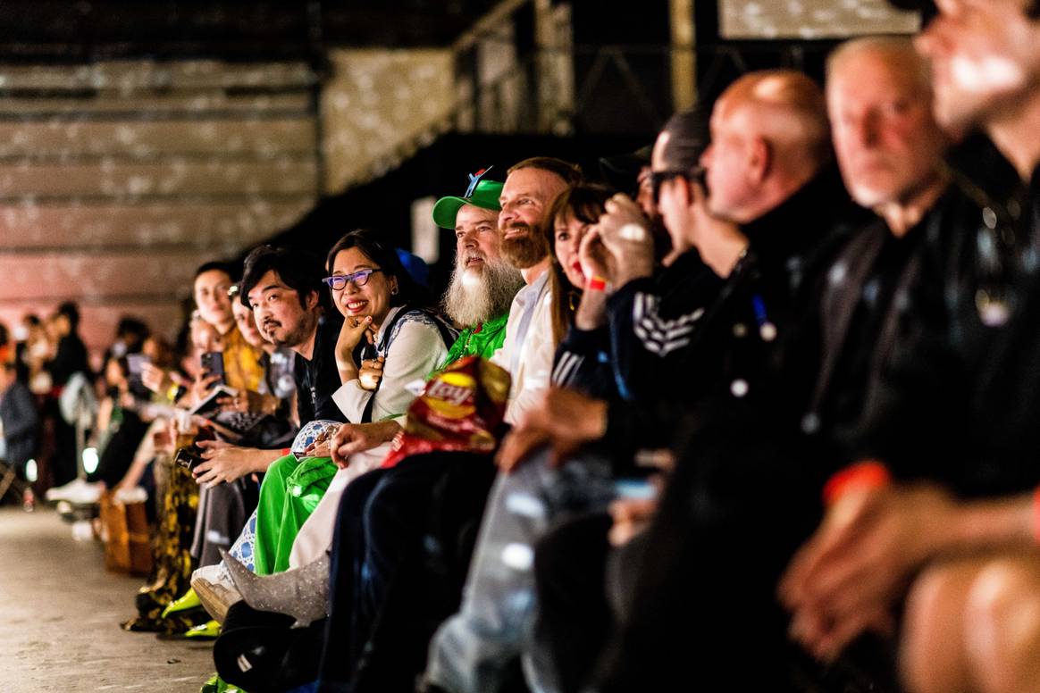 Walter van Beirendonck, in green overalls, during the show. Image: Dries Luyten via David Flamée