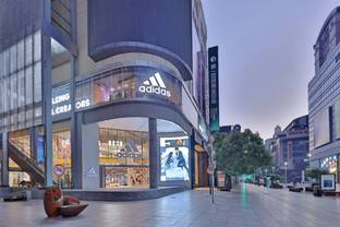 Adidas reveals improved outlook