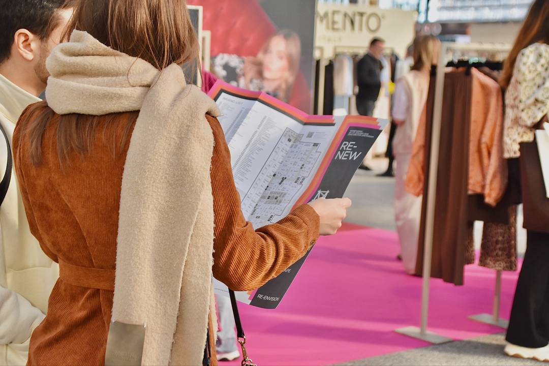 With a map in hand, visitors search for the correct route at the Dutch trade show Modefabriek in Vijfhuizen.