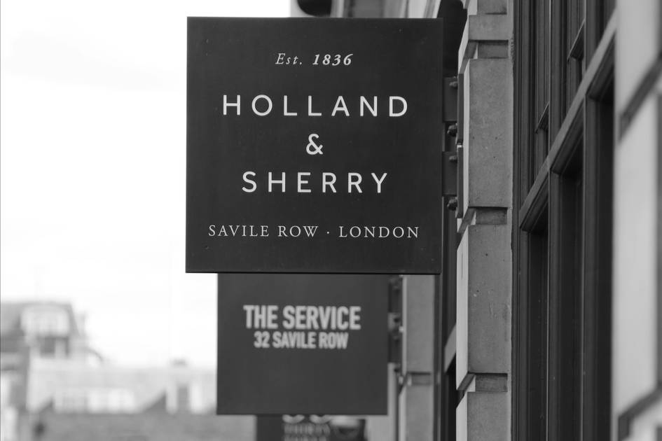 Young apprentices working at Savile Row tailors