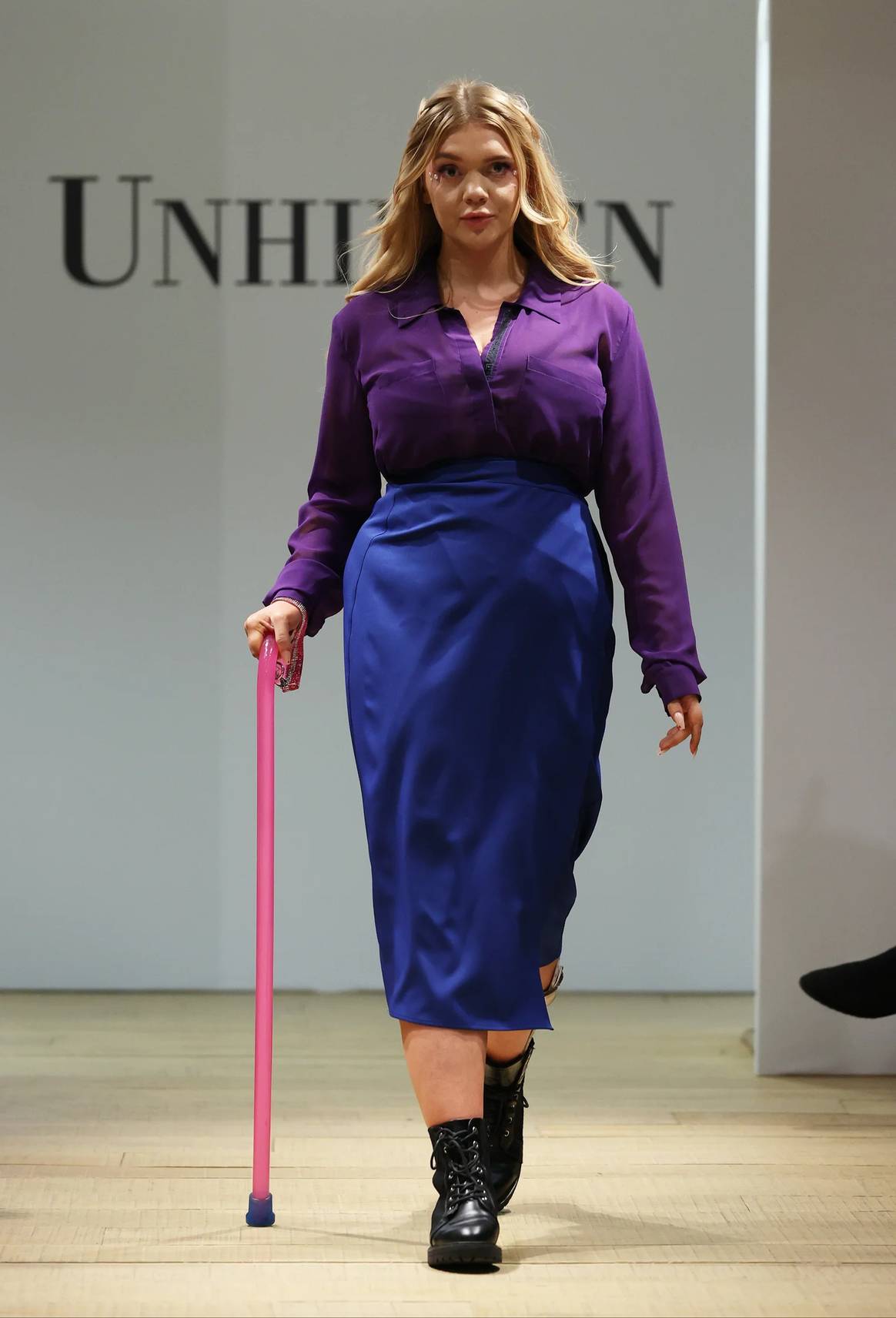 Model with walking cane in wraparound skirt in Unhidden runway show
Feb 23