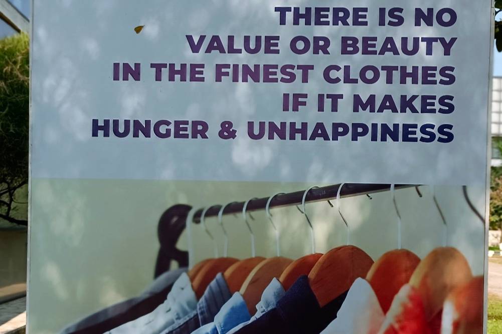 "There is no value or beauty in the finest clothes if it makes hunger & unhappiness." Credits: Poster at Made in Bangladesh Week, Dhaka. Image: Sumit Suryawanshi for FashionUnited