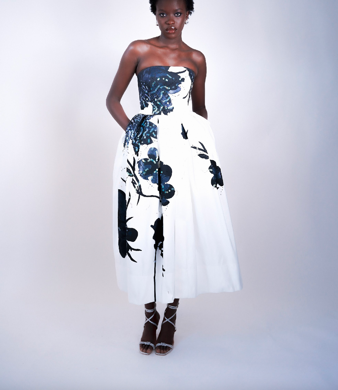 The couture gown features two distinct shades of Sparxell's signature blue - a sophisticated matte finish and a brilliant shimmery effect