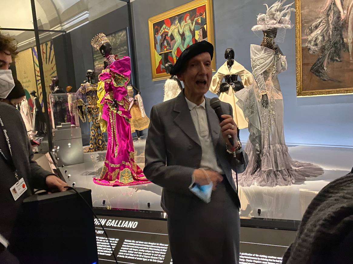 Stephen Jones in front of Galliano for Dior garments Ph. FashionUnited