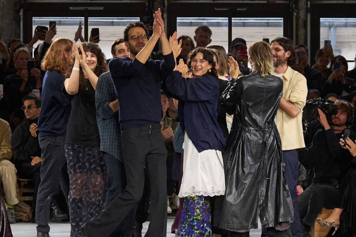 Dries van Noten's studio team takes their first bow. Julian Klausner is seen in the front with glasses.