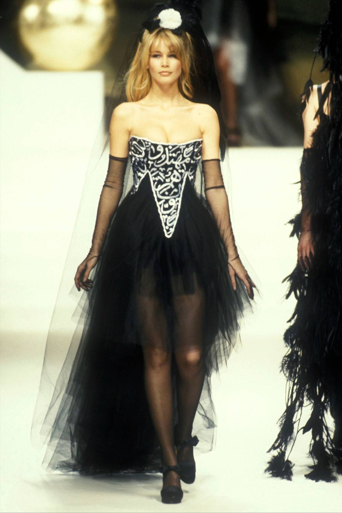 One of the three famous Chanel dresses
with Quranic texts on them. Chanel SS94, image via Catwalkpictures.com.