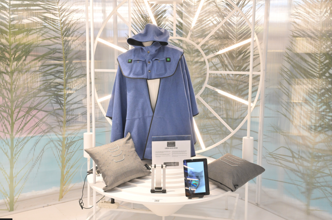 This heated poncho keeps the wearer warm. Seen at the Texhibition Innovation Hub.