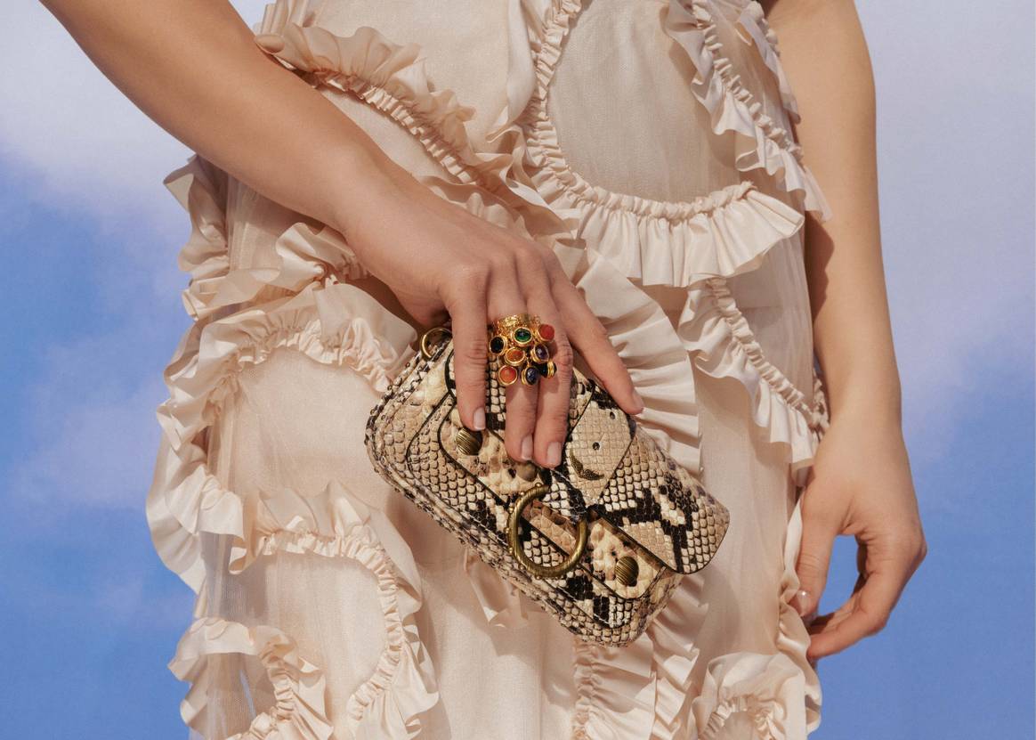 Moncler dress and Jacquemus bag / De Bijenkorf