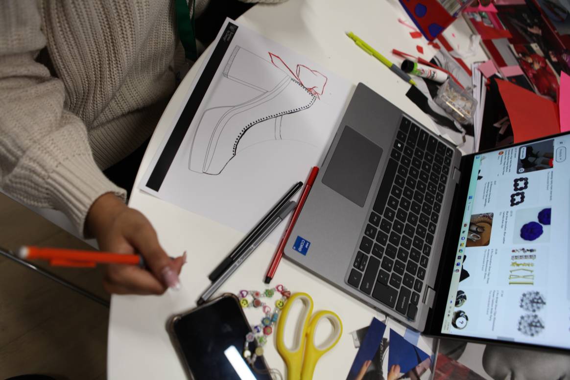 Student sketching at the Kurt Geiger Business by Design Academy