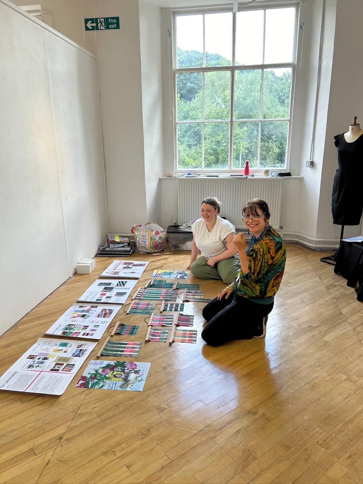 Students setting up their work for the master degree show at Heriot-Watt's High Mill building.