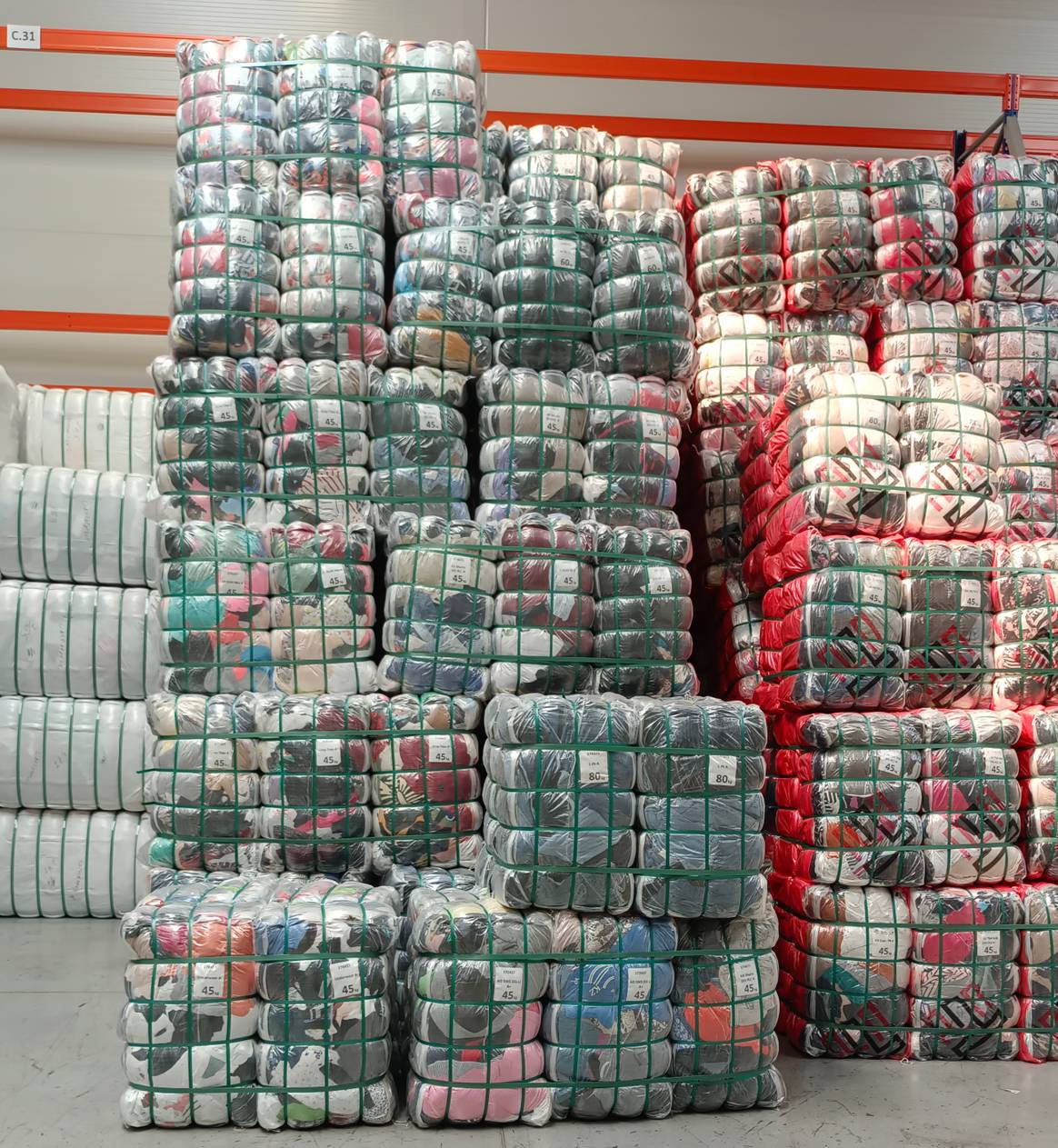 Specific garments as requested by the wholesale client, neatly sorted.