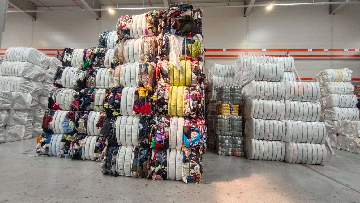 An impressive stack of clothes, pre-sorted and ready for their new life.