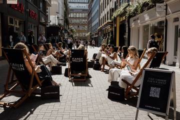 Karen Millen highlights work-life imbalance with London lounge stunt