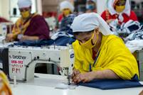 Grüner Knopf und Fair Wear starten strategische Partnerschaft 