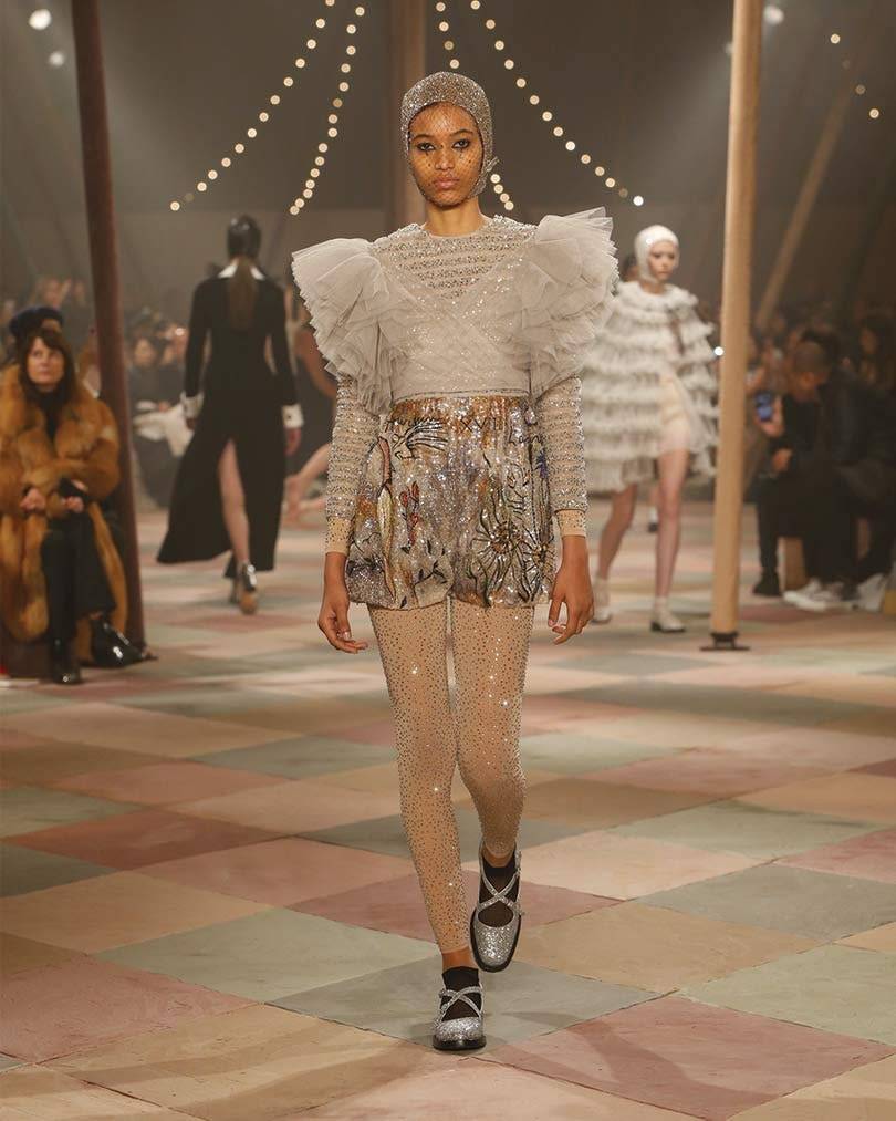 Fashion rolls up for Dior's chic strongwoman circus