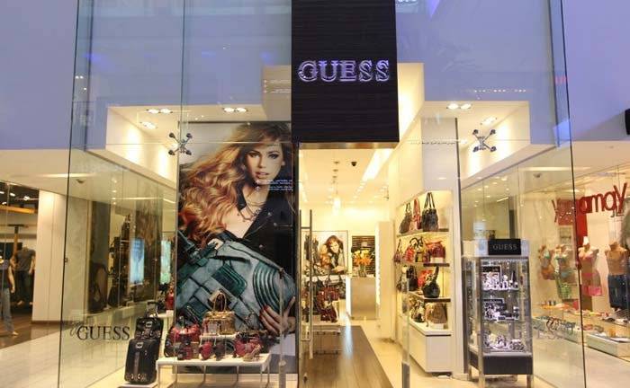 Guess earnings decline 13.4 percent, announces weak outlook