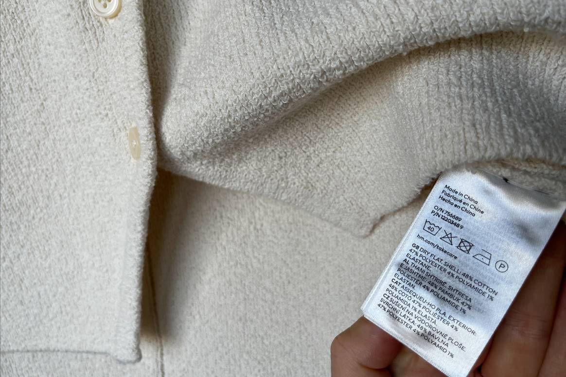 Care instructions and composition of a garment on a label.