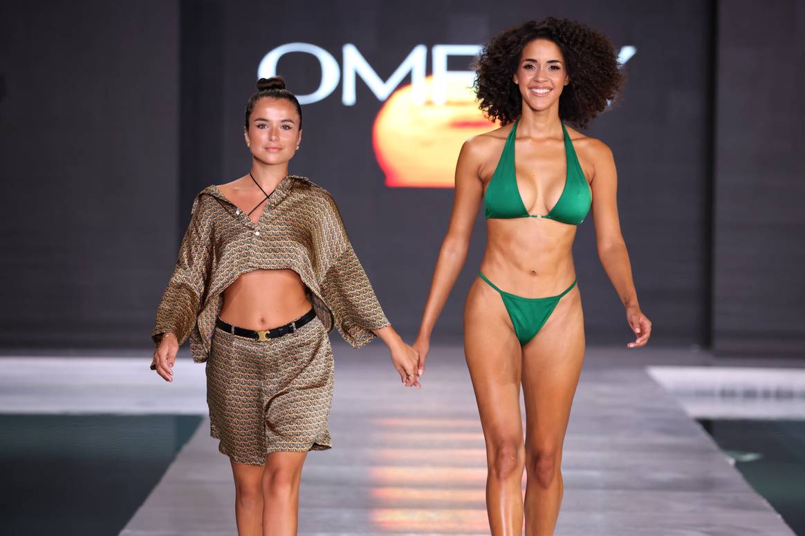 Omray designer Omray Kupeli (left) at the finale of the brand's Miami Swim Week, 2024.