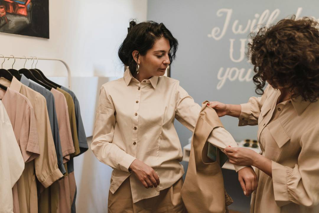 A store employee helps a customer.