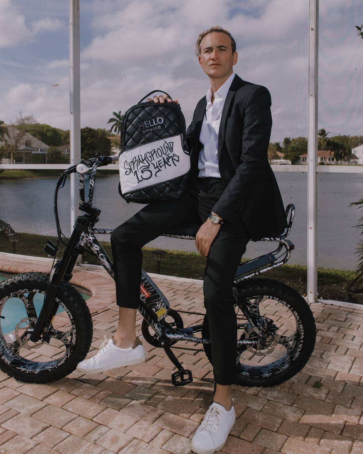 David, founder of Sprayground, with 15th anniversary backpack