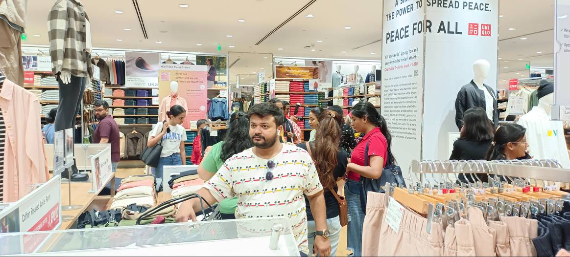 Customers checking out Uniqlo clothing