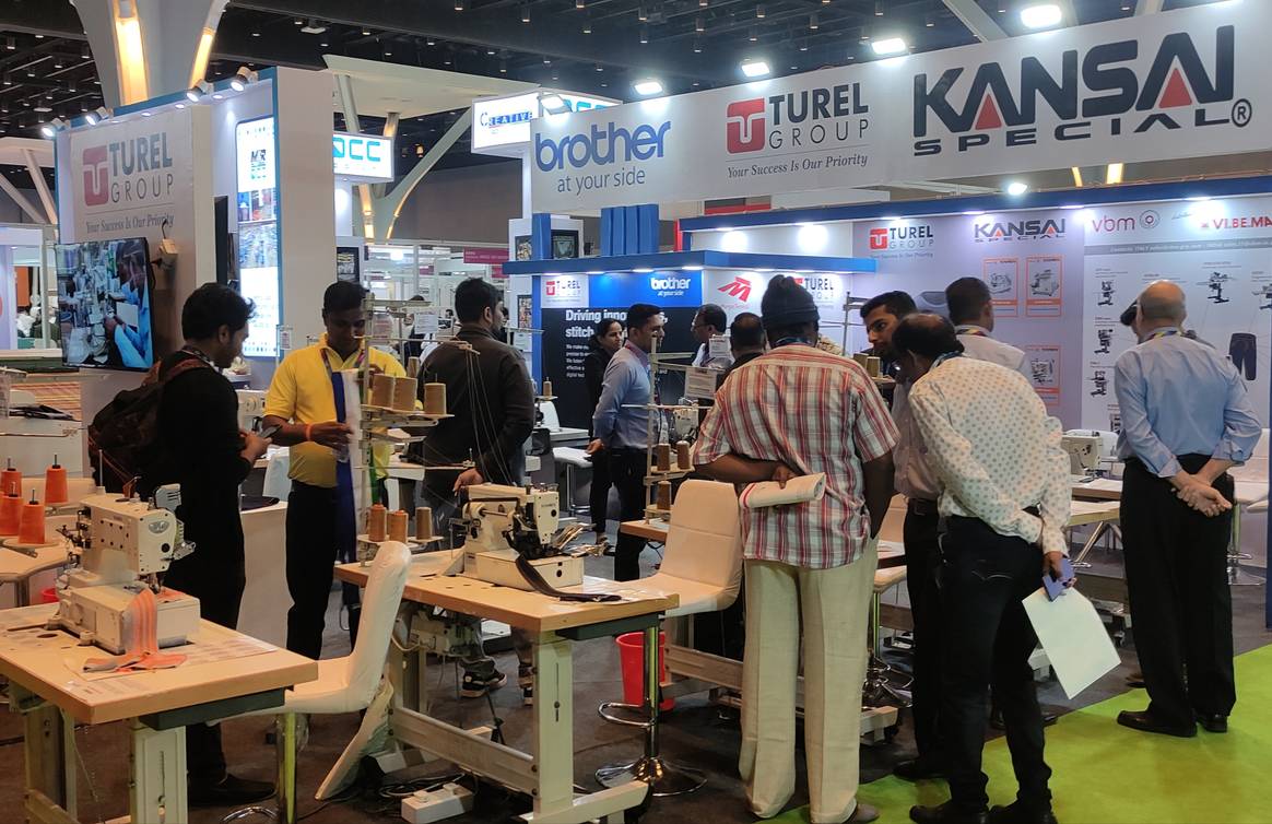 Sewing machines drew much interest, as seen at this distributor’s booth.