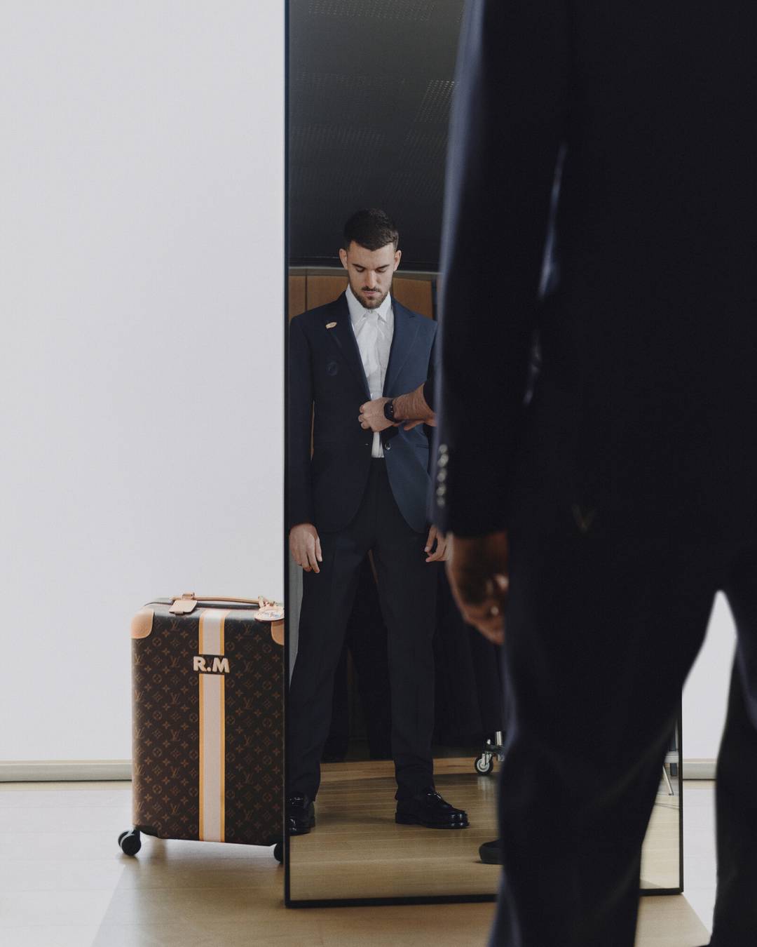 Dani Ceballos in ‘Louis Vuitton x Real Madrid’ collection with matching suitcase